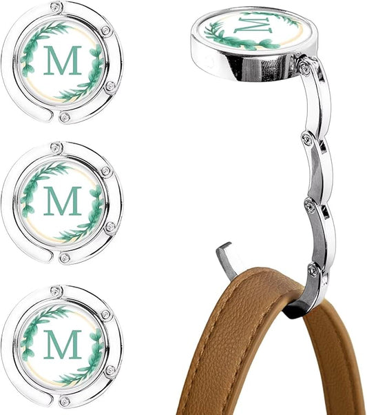 XSUIOY 3Pcs Personalized Initial Foldable Purse Hook for Table,Crushed Flower Letters Folding Purse Hanger,Purse Holder Handbag Hanger Collection Desk Table Bag Hooks Gifts for Women Bag(Green-M)